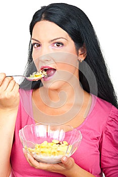 Portrait of healthy woman eating cereals