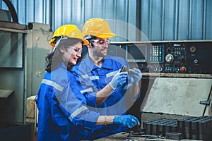 Portrait of Heavy industry workers working on the metal fabrication process by operating a lathe at a machine for steel structure