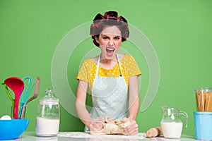 Portrait of her she nice attractive glamorous angry fury mad irritated housewife cooking kneading dough on table desk