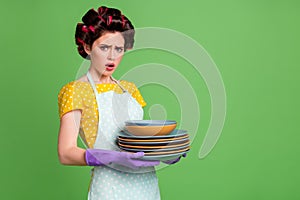 Portrait of her she nice attractive glamorous overwhelmed depressed maid wearing curlers holding in hands tidy neat pile