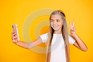 Portrait of her she nice attractive lovely cheerful cheery funny positive girlish pre-teen girl holding cell in hands