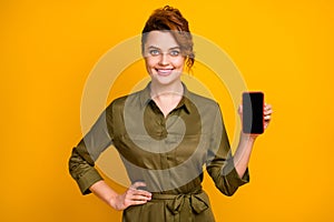 Portrait of her she nice attractive lovely pretty cheerful cheery wavy-haired girl showing new gadget device isolated on
