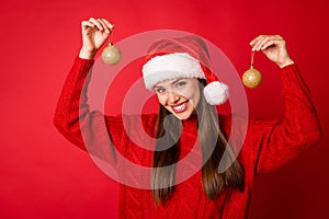 Portrait of her she nice attractive pretty cheerful girl holding in hands showing demonstrating festal tree decor balls