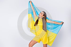 Portrait of her she nice beautiful lovely dreamy cheerful straight-haired girl fan holding in hands Ukrainian flag