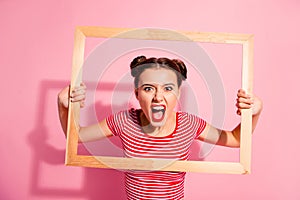 Portrait of her she nice cute charming attractive glamorous aggressive girl in striped t-shirt holding in hands wooden