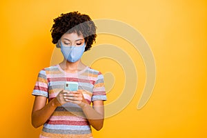 Portrait of her she nice focused attractive wavy-haired girl wearing safety reusable mask using device browse mers cov