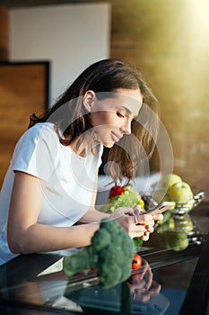 Portrait of her she nice-looking attractive lovely girl reading recipe online on the phone fresh lunch dinner farm organic vegs in