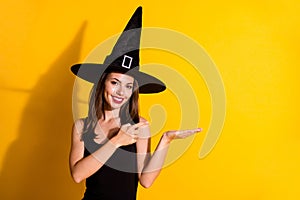 Portrait of her she nice-looking attractive pretty cute content cheerful lady wizard holding on palm showing copy space