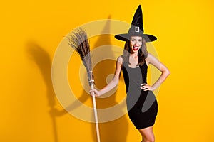 Portrait of her she nice-looking attractive pretty slender cheerful cheery lady wizard holding in hand broom magic