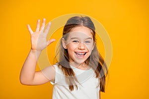 Portrait of her she nice-looking cute attractive lovely pretty cheerful cheery positive pre-teen girl waving hi hello