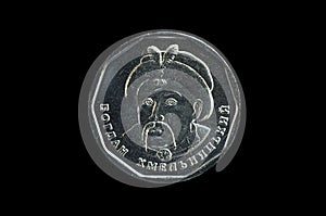 Portrait of the hetman Bogdan Khmelnytsky on obverse of the hryvna five coin, isolated on a black background