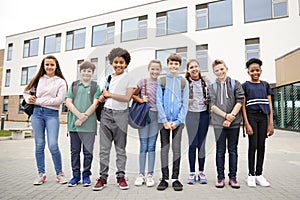 Portrait Of High School Student Group Standing Outside School Buildings
