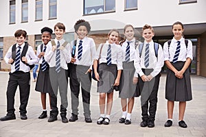 Portrait Of High School Student Group Wearing Uniform Standing Outside School Buildings