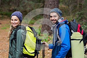 Portrait of hiker couple hiking in forest