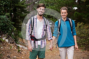 Portrait of hiker couple hiking in forest