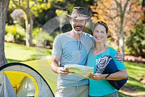 Portrait of hiker couple holding map