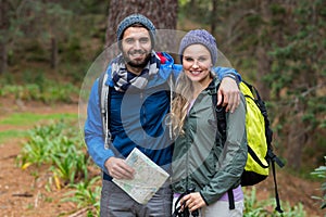 Portrait of hiker couple standing at countryside