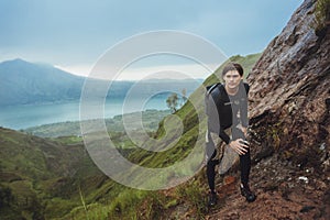 Portrait of hiker man posing on the mountain, freedom concept. A