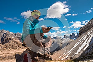 Portrait of hiker woman GPS navigator in mountains