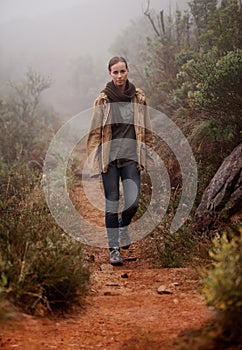 Portrait, hiking and woman in nature for travel, wellness or morning walk outdoor in winter. Path, trekking and female