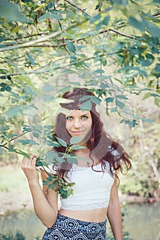 Portrait of hippie girl in forest