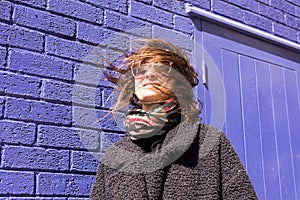 Portrait of Hipster woman with wind messing up her hair