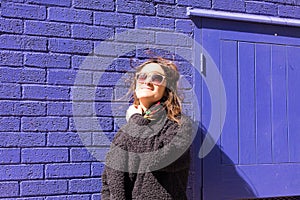 Portrait of Hipster woman with wind messing up her hair