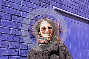 Portrait of Hipster woman with wind messing up her hair photo