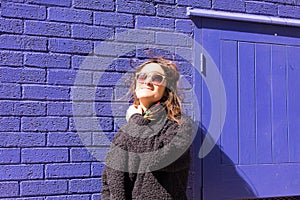 Portrait of Hipster woman with wind messing up her hair photo