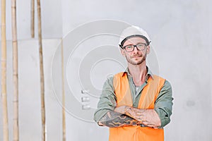 portrait hipster worker cosntruction engineer architect . builder foreman work in construction site smart arm crossed confident