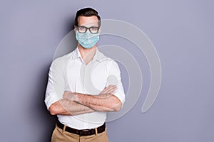 Portrait of his he attractive healthy guy wearing safety gauze mask folded arms stop influenza mers cov pandemia copy