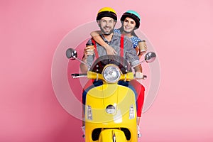 Portrait of his he her she nice attractive cheerful cheery glad couple driving moped drinking latte cappuccino having