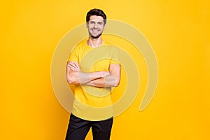 Portrait of his he nice attractive lovely cheerful cheery glad content guy wearing tshirt folded arms good mood isolated