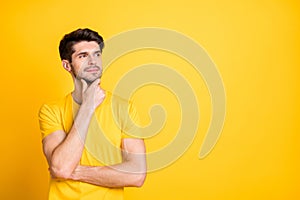 Portrait of his he nice attractive minded pensive creative brown-haired guy wearing tshirt thinking touching chin copy