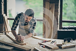 Portrait of his he nice attractive skilled hardworking guy creative self-employed engineer carving wood home-based