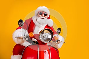 Portrait of his he nice funny cheerful cheery cool confident hipster Santa riding moped fast speed winter December sale