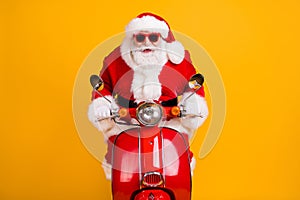 Portrait of his he nice funny cheerful focused Santa riding moped fast speed winter December Eve Noel sale discount