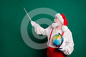 Portrait of his he nice handsome cheerful knowledgeable clever smart fat bearded Santa professional teacher holding in