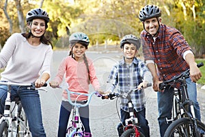 Portrait Of Hispanic Family On Cycle Ride