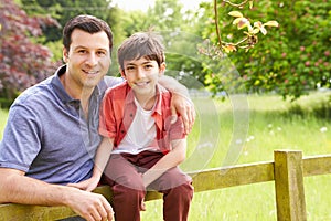 Portrait Of Hispanic Father And Son