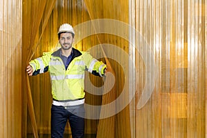 Portrait Hispanic latin engineer happy working opening warehouse industry hygiene yellow pvc curtain