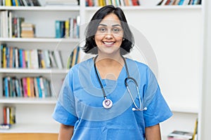 Portrait of hispanic nurse looking at camera