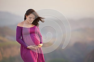Portrait of hispanic pregnant woman