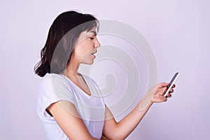 Portrait of hispanic young woman using a mobile phone