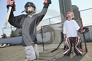 Portrait of hockey ball player with hockey stick