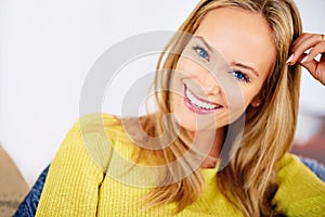 Portrait, home and relax with woman, happiness and weekend break with comfort and vacation in a living room. Face