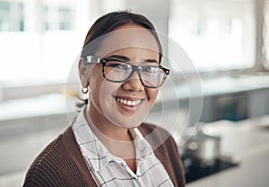 Portrait, home and smile with asian woman, glasses and happiness and relaxing in kitchen. Face, person and girl with