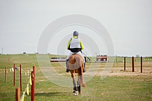 Horse and rider going to start eventing competition photo