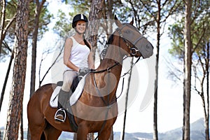 Portrait, horse riding or happy woman in woods or forest with rider or jockey for recreation or adventure. Smile, relax