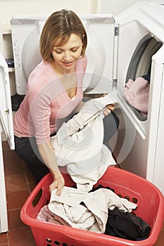 Portrait Of Housewife Doing Laundry